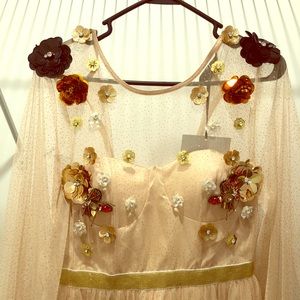 Formal dress with sheer sleeves and sequin detail